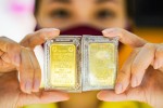 Giá vàng hạ nhiệt khi kinh tế Mỹ và đồng USD gượng dậy